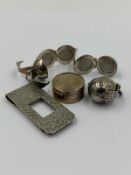 A small selection of silver items to include, two globe metamorphic picture lockets, pill box and