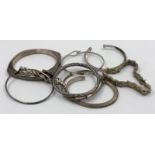 A selection of silver bangles in varying styles, approximate weight of 140g