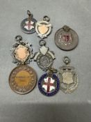 A selection of sporting medals some silver