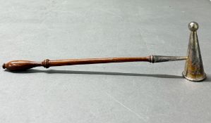 A hallmarked silver candle snuffer on a wooden handle, London 1972 by CJ Vander Ltd