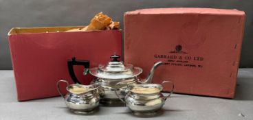 A Garrard & Co three piece silver plated tea service including teapot, milk jug and sugar bowl