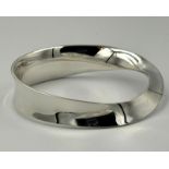 A Georg Jensen silver bangle, with twisted design approximate weight 53g and approximate width 76mm