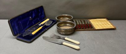 A selection of silverplate boxed and unboxed flatware to include butter knives and forks and two
