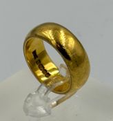 A 22ct yellow gold wedding band, approximate size M and weight 13.6g