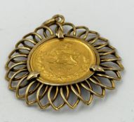 A 21ct gold Pahlavi coin in 9ct gold pendant setting, approximate weight 7.8g