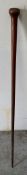 A wooden walking stick with a bulbous handle W89cm
