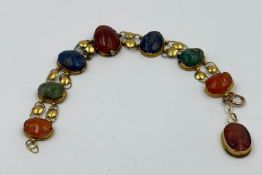 Vintage Egyptian Revival bracelet featuring carved stones set in gold