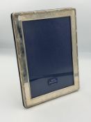 A hallmarked silver easel backed picture frame by Kitney & Co, hallmarked for London 1994 21.5cm x