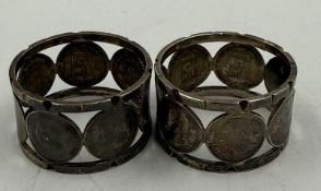 A pair of silver napkin rings with Venezuelan 50-cent inserts approx weight 63g
