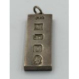 A 1977 hallmarked silver jubilee ingot pendant, approximate weight 31g