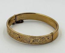 A 9ct gold, metal core, hinged bracelet, approximate weight 14.2g