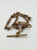 A 9ct gold fancy link Albert chain with T Bar, approximate length 36cm.
