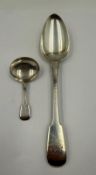 A Georgian silver serving spoon 1813 William Charles and Henry Ely, together with a caddy spoon,