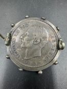 A silver five pesetas Alfonso XII coin dated 1885 in a brooch setting