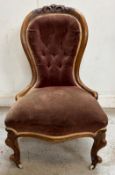 Victorian spoon back lounge chair on cabriole legs with castors