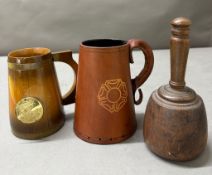 Two decorative tankers and a wooden mallet with an inscription