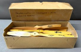 A box of wooden JZ Zinger propellers