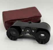 A set of Ross Operos , cased, opera glasses.