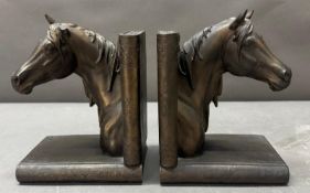 A pair of bronze effect horse heads book ends