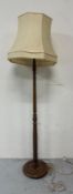 A turned wooden standard lamp