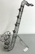 A wire saxophone shaped sculpture