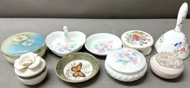 A selection of porcelain trinket boxes and pin dishes of various makers and designs, including