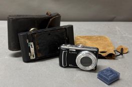 A Panasonic Lumix digital camera and one other