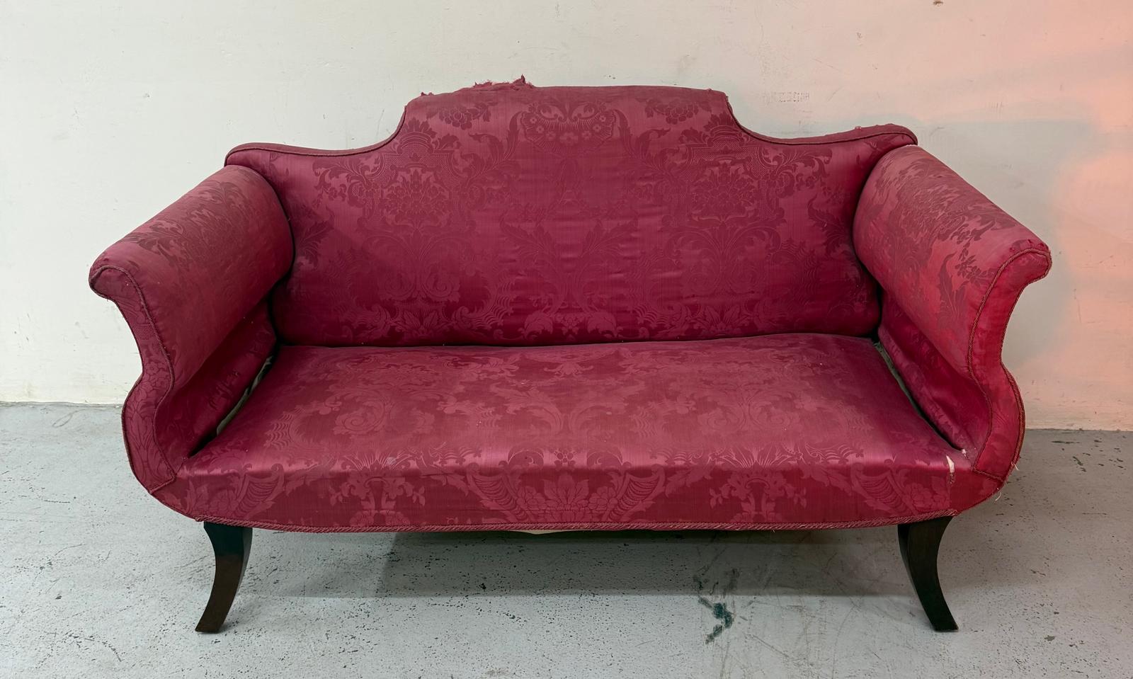 A red floral upholstered Victorian two seater sofa H84cm W150cm D76cm SH32cm Condition Report in
