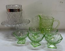 A mid-century green glass pitcher and five compots together with a cut glass cake stand and