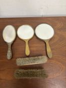 A selection of vintage grooming or vanity items to include three mirrors and two brushes