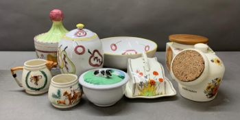 A selection of kitchen ceramics, various makers and styles, including cookie jars, a creamer and a