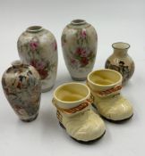 A selection of miniature vases and a pair of china books