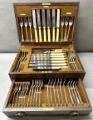 A stainless steel cutlery canteen in wooden case