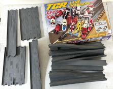 A selection of loose Total Control racing track, cars and other racing components