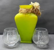 Two cut glass trophies and a green glass vase