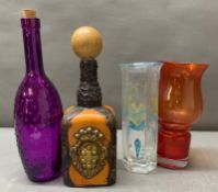 A selection of bottles and vases, including a purple dimpled vase