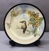 A Royal Doulton Kookaburra series plate, white grounds and featuring a Kookaburra on a wattle branch