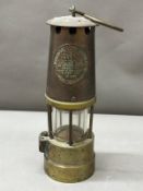 The Protector Lap and Light Company of Eccles Manchester lamp, approximate height 27cm