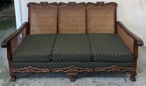 Edwardian style Bergère sofa and two armchairs, walnut frame and cane panels