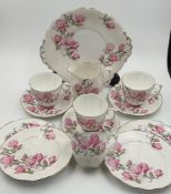 Roslyn tea part service Magnolia four sandwich plates, milk jug, four cups and three saucers