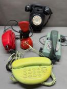 Five vintage telephones in various styles