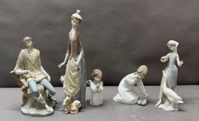 A selection of five Lladro porcelain figures to include: Girl praying, Girl with slippers, Woman