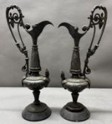 A pair of Decorative metal ewers, approximate height 37cm.