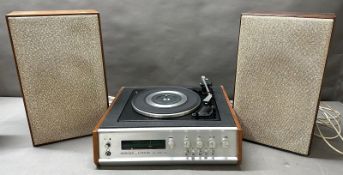 A 1970's Hacker centurion High Fi unit, featuring a built-in Garrard turntable and Fm radio with