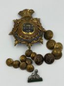 A selection of Dorsetshire regiment insignia, buttons, helmet plate etc