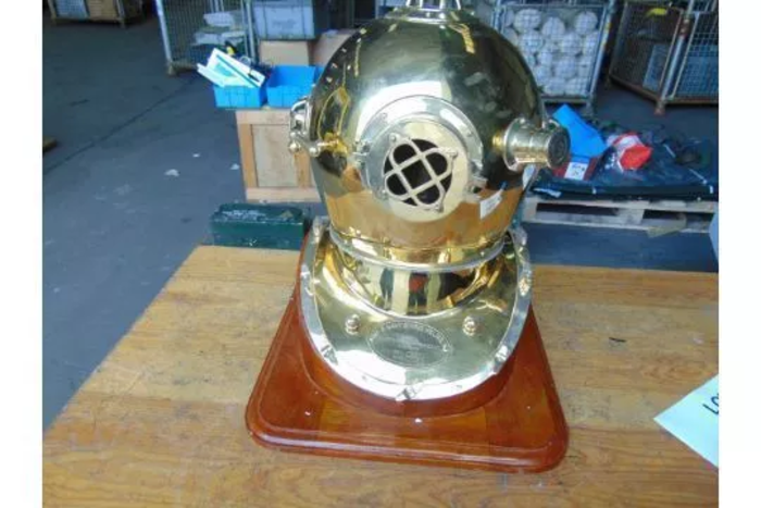 Replica Full Size U.S. Navy Mark V Brass Diving Helmet on wooden display stand.