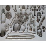 A large assortment of silver jewellery to include pendant chains, charms bracelet, bangles, rings, p