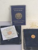A cased QEII Silver Jubilee 9ct gold commemorative medal, 2.5g and two Westminster quarter gold sove