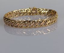 A yellow gold fancy-link bracelet with safety clip, 18.5 cm, 12g