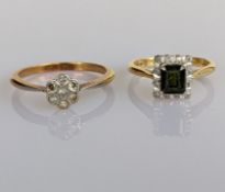 An Art Deco diamond flower ring on a platinum and yellow gold setting, together with a green topaz